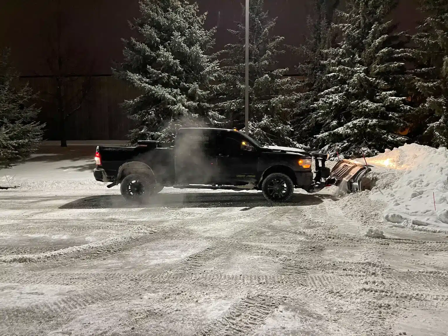 Ice management with sanding and salting for commercial areas in Edmonton