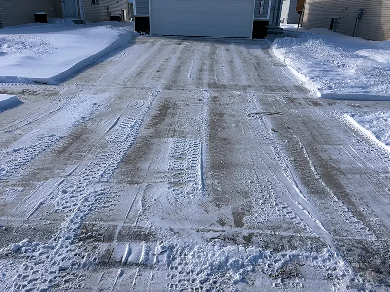 Residential driveway snow clearing in Edmonton after snowfall