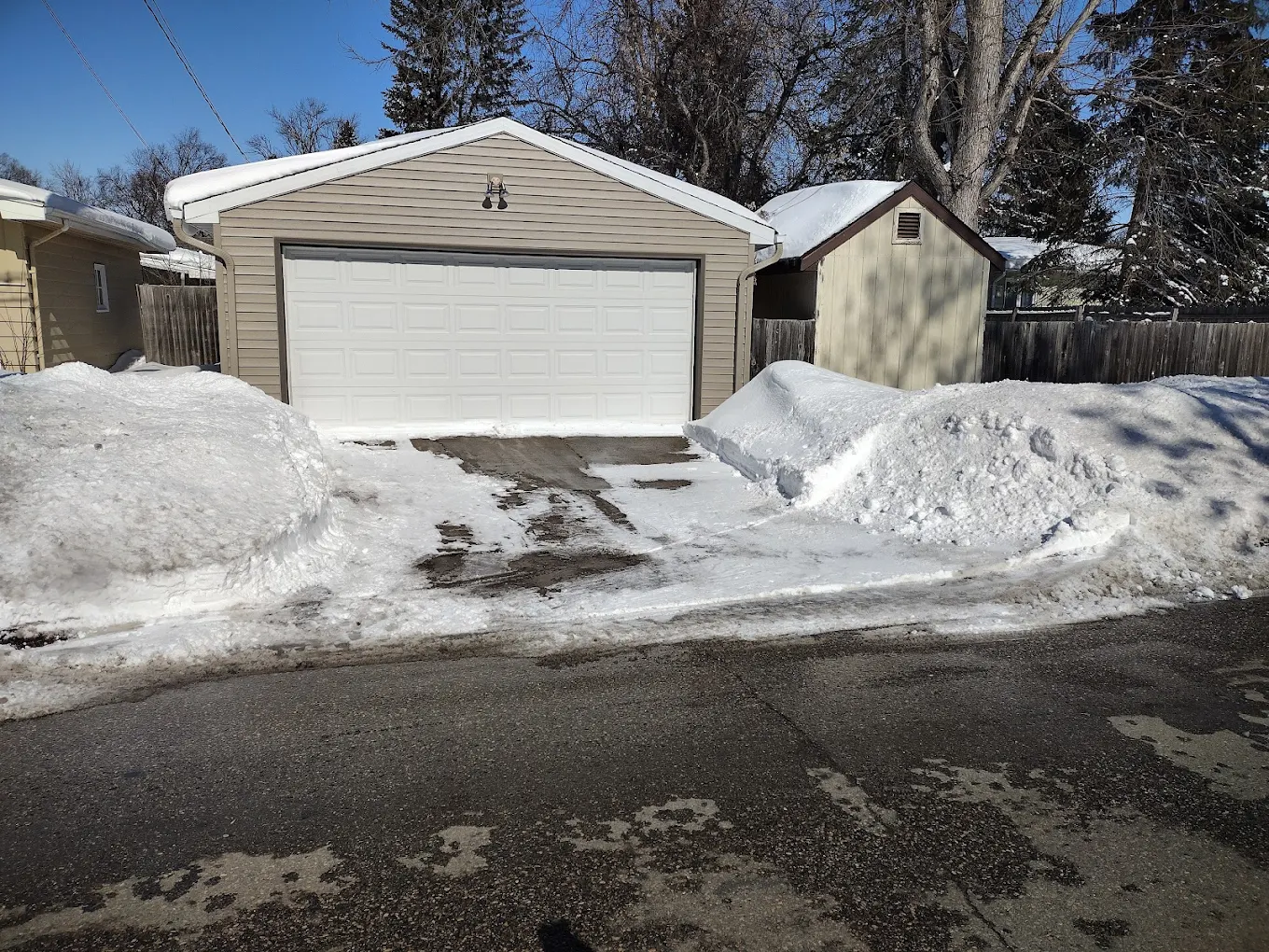 Garage driveway snow clearing in Edmonton by Snowbear