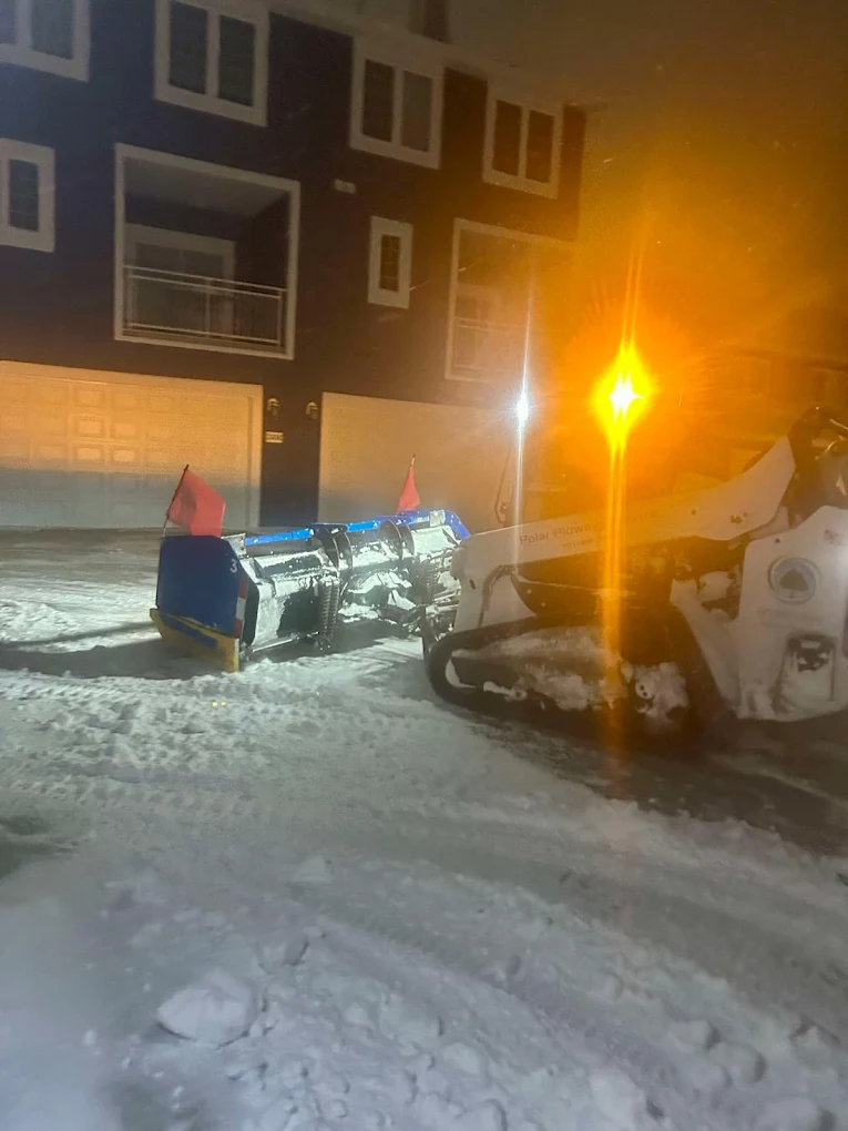 Night commercial snow clearing in Edmonton for emergency response