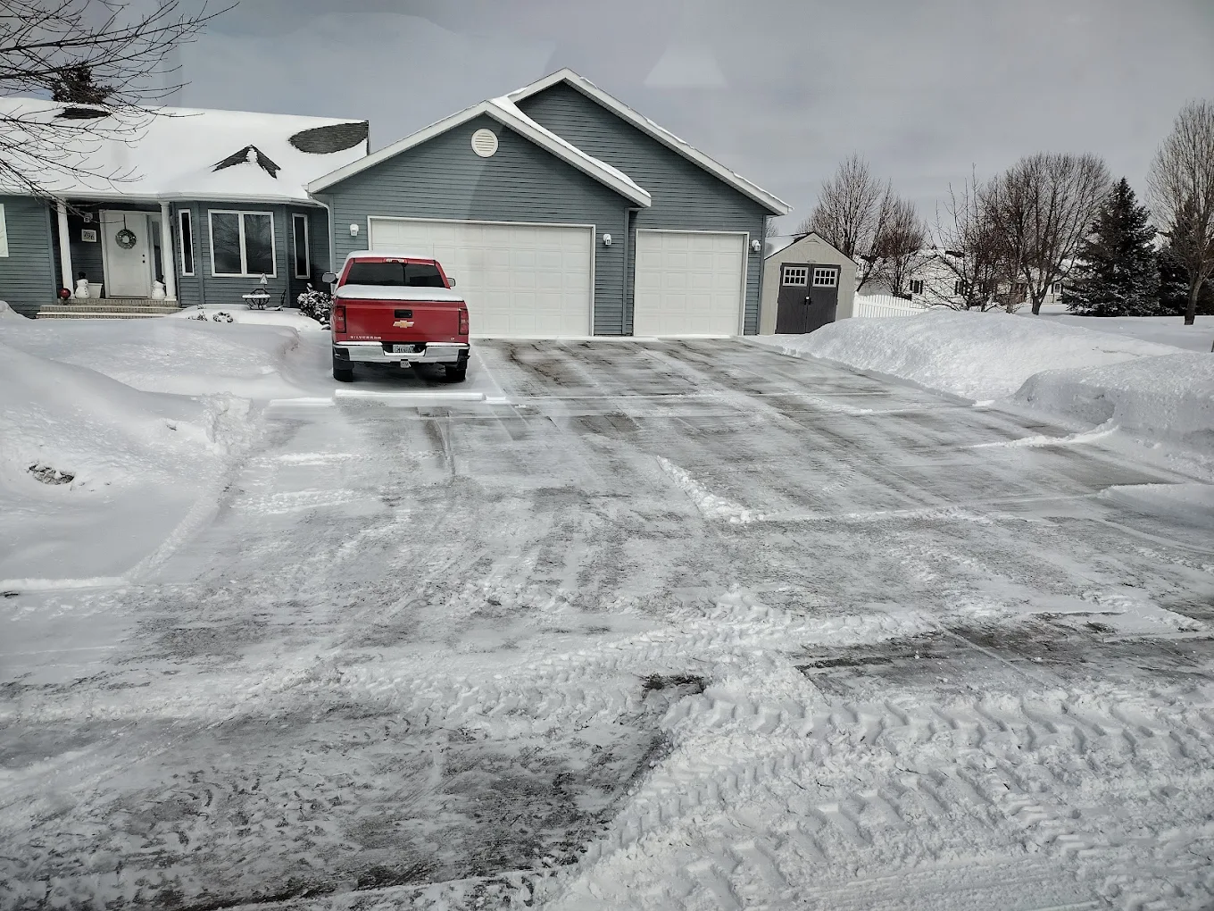 Residential snow removal in Edmonton with clean driveway edges